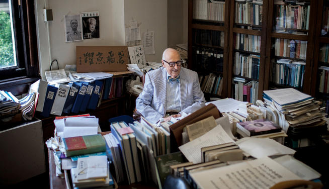 De Bary in his Kent Hall office, a virtual library of Asian philosophy and literature. PHOTO: NATALIE KEYSSAR